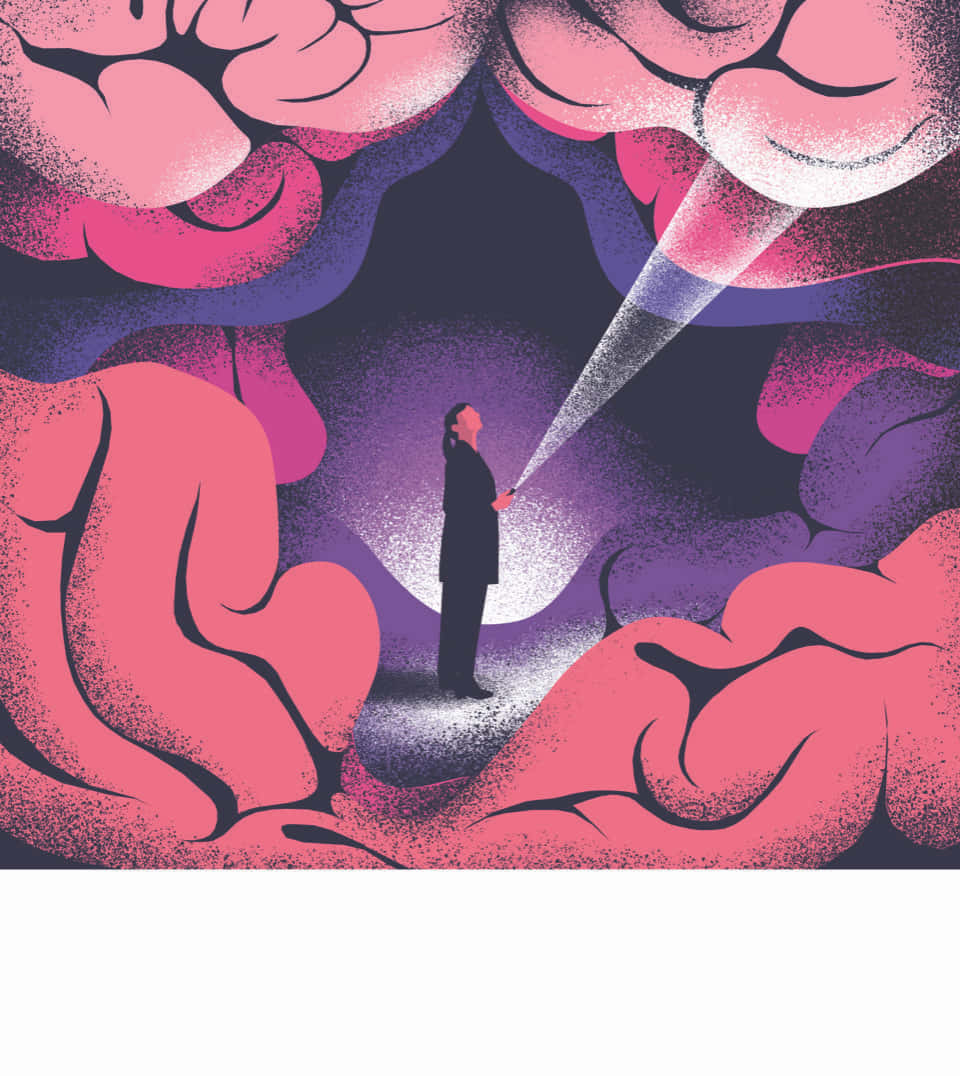 人在巨大腦形洞穴內手持手電筒。