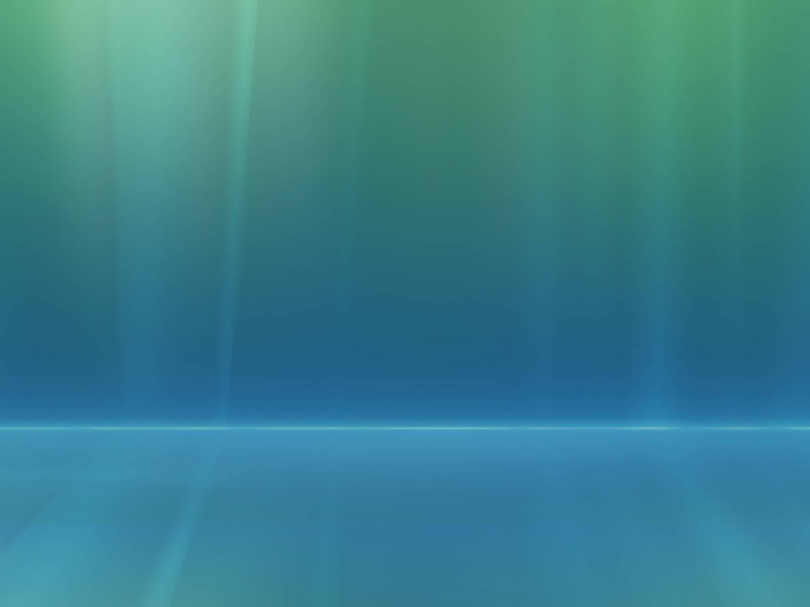 自然風景 Windows Vista 壁紙 — 柔和的藍綠漸變光線照亮了一個帶有反射地板的空曠抽象工作室空間。