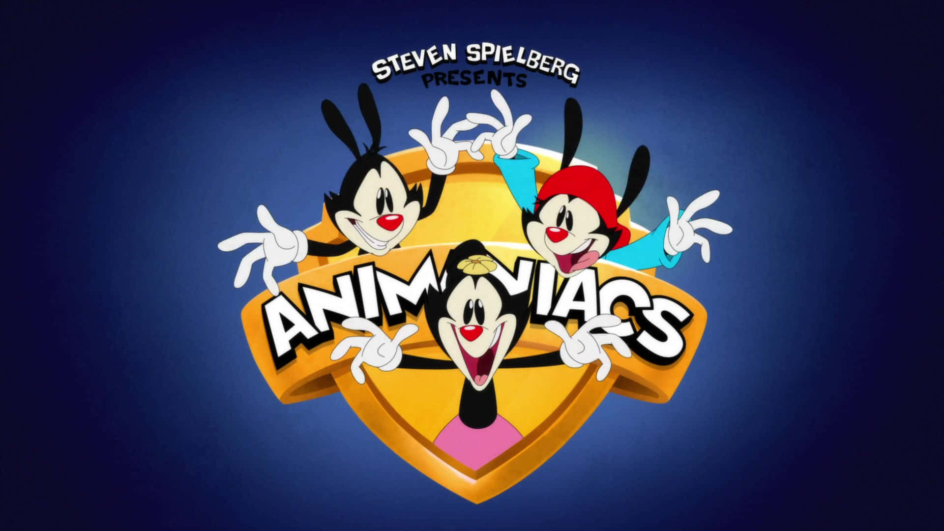 與 Animaniacs 共度愉快的一天 壁紙 — 三隻穿著紅色、藍色和粉紅色服裝的卡通兔子，在深藍色漸變背景前，圍著一個金色盾牌標誌愉快地擺姿勢。