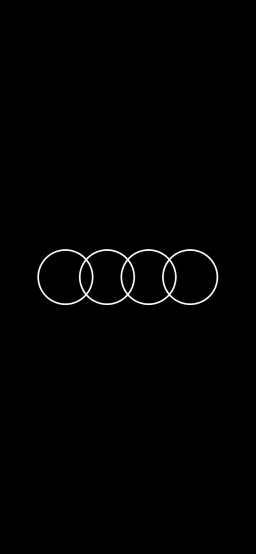 黑色背景上的四個相互交織的白色圓環 Audi 標誌