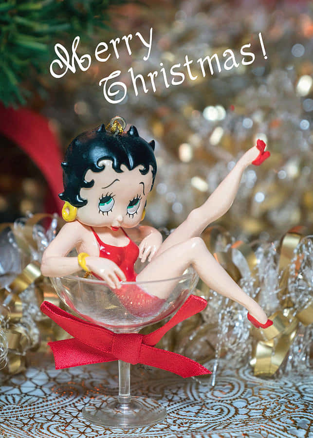 Betty Boop 公仔在香檳杯裝飾中，帶有「聖誕快樂」文字。