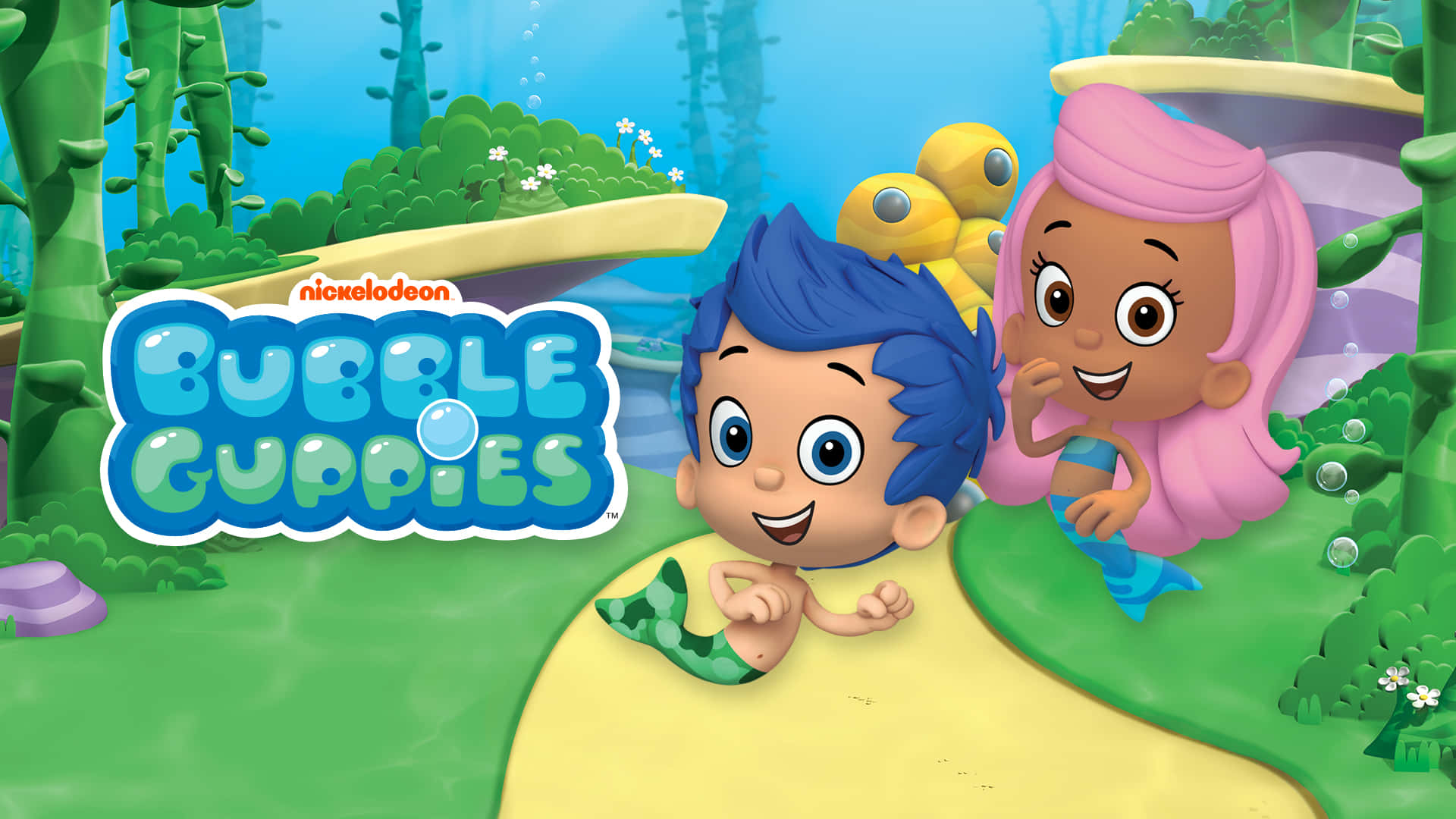 與Bubble Guppies共度歡樂時光 壁紙 — 兩個開心的卡通美人魚小孩探索充滿珊瑚和氣泡的 vibrant 海底世界。