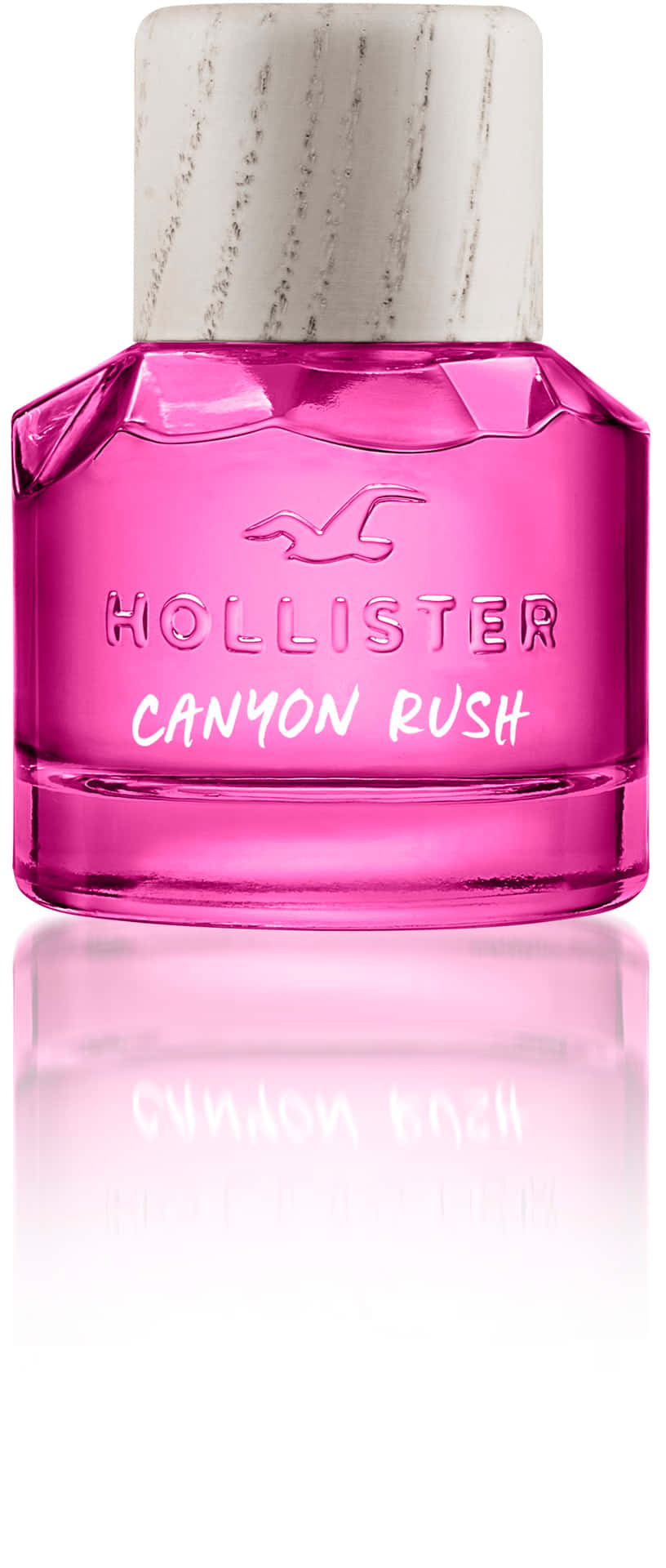 粉紅色Hollister Canyon Rush香水瓶，白色瓶蓋，置於反光表面。
