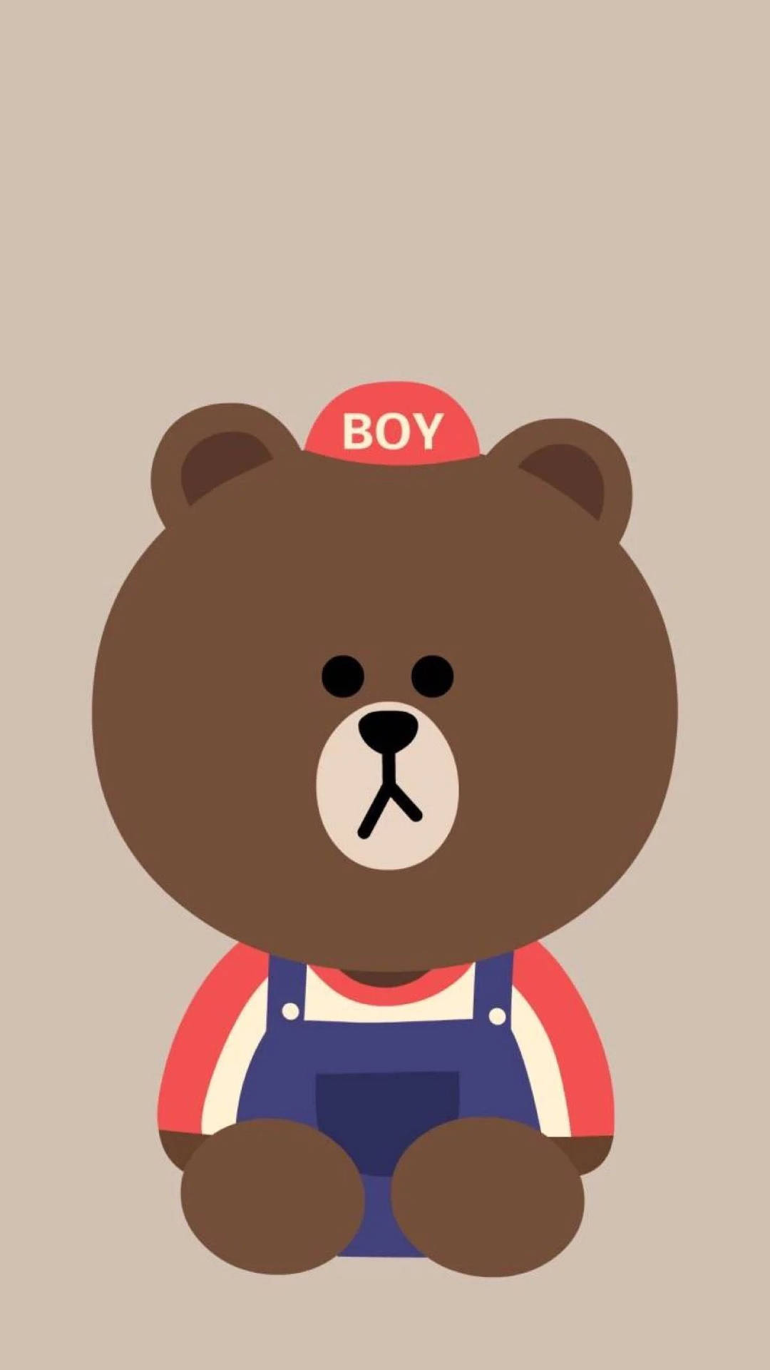 一隻卡通小熊穿著工裝褲和寫有BOY的帽子。