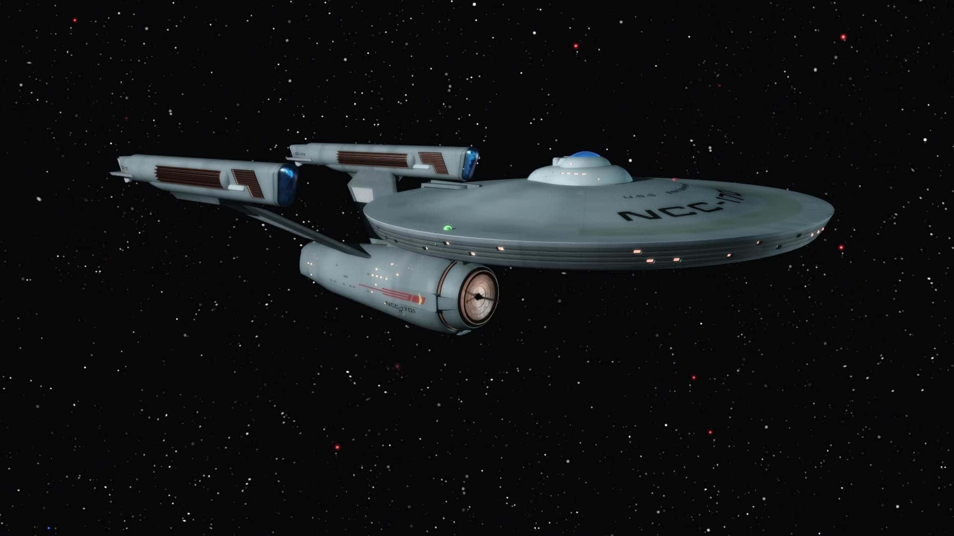 灰色星艦NCC-1701漂浮在滿是星星的太空。
