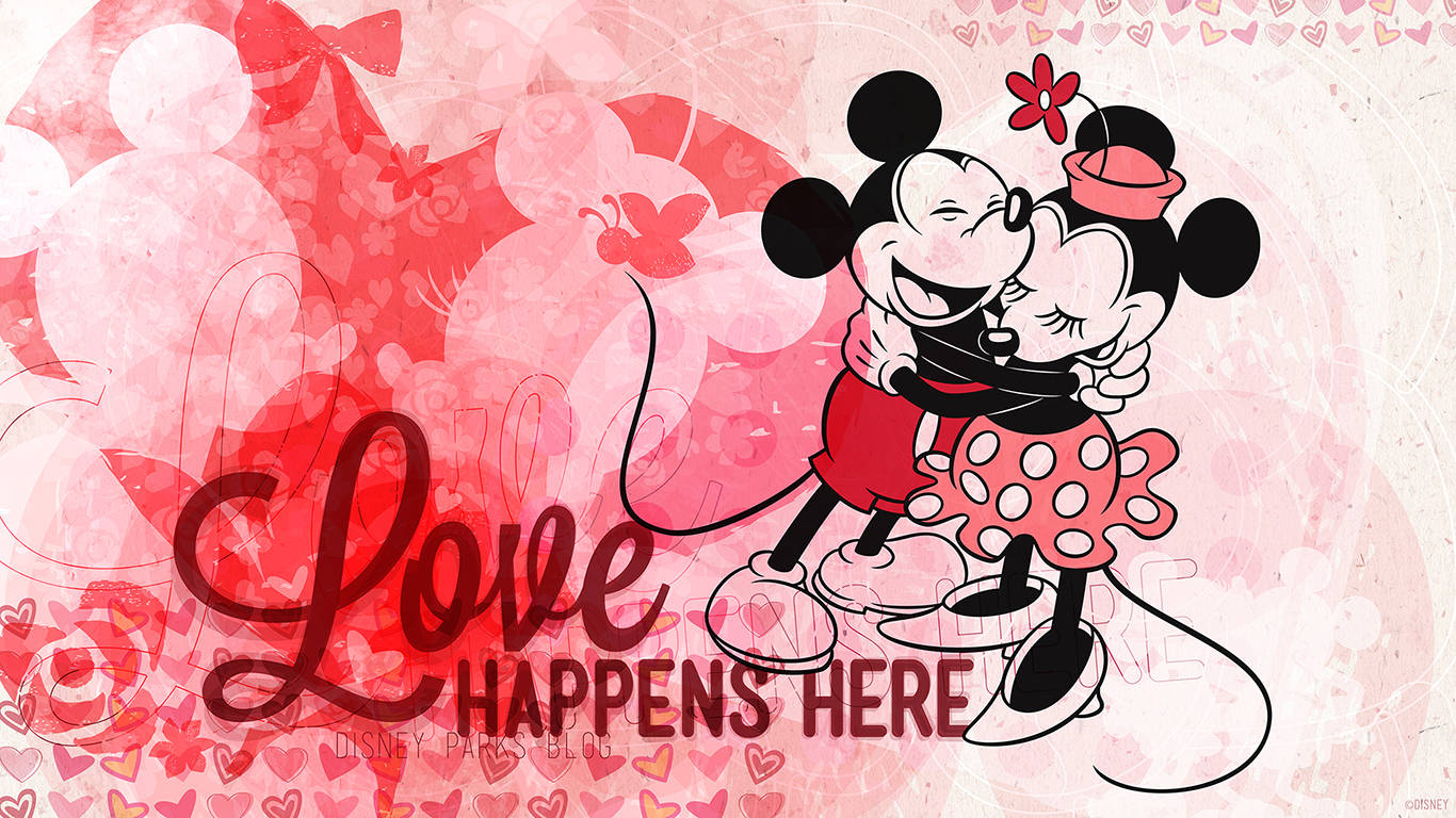 米奇和米妮老鼠在充滿愛意的擁抱中，伴有心形和「Love Happens Here」文字。 — 情人節 壁紙