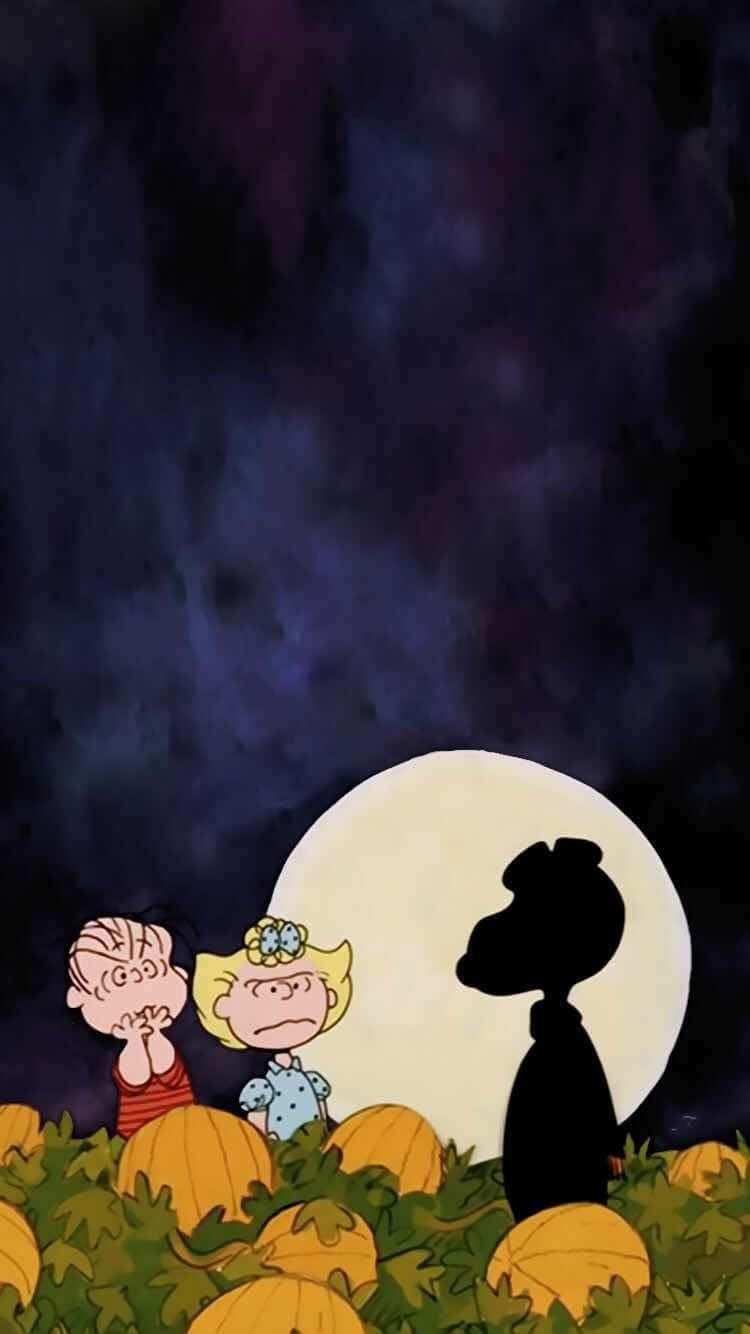 花生漫畫角色在夜晚滿月下的南瓜田