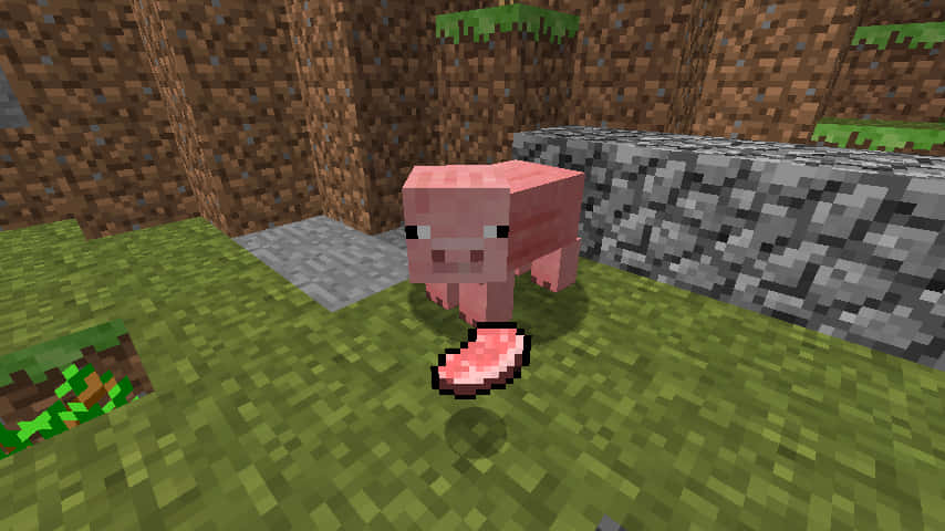 一隻粉紅色的Minecraft豬站在石塊附近的草地上。