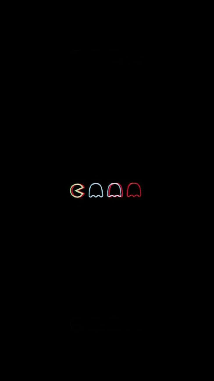 四個發光的 Pac-Man 鬼魂，以霓虹色呈現，黑色背景。