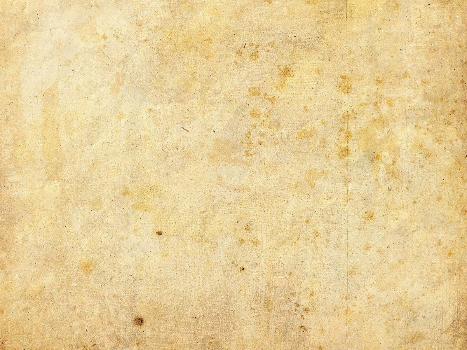 帶有黃色污漬和紋理表面的復古羊皮紙背景。
