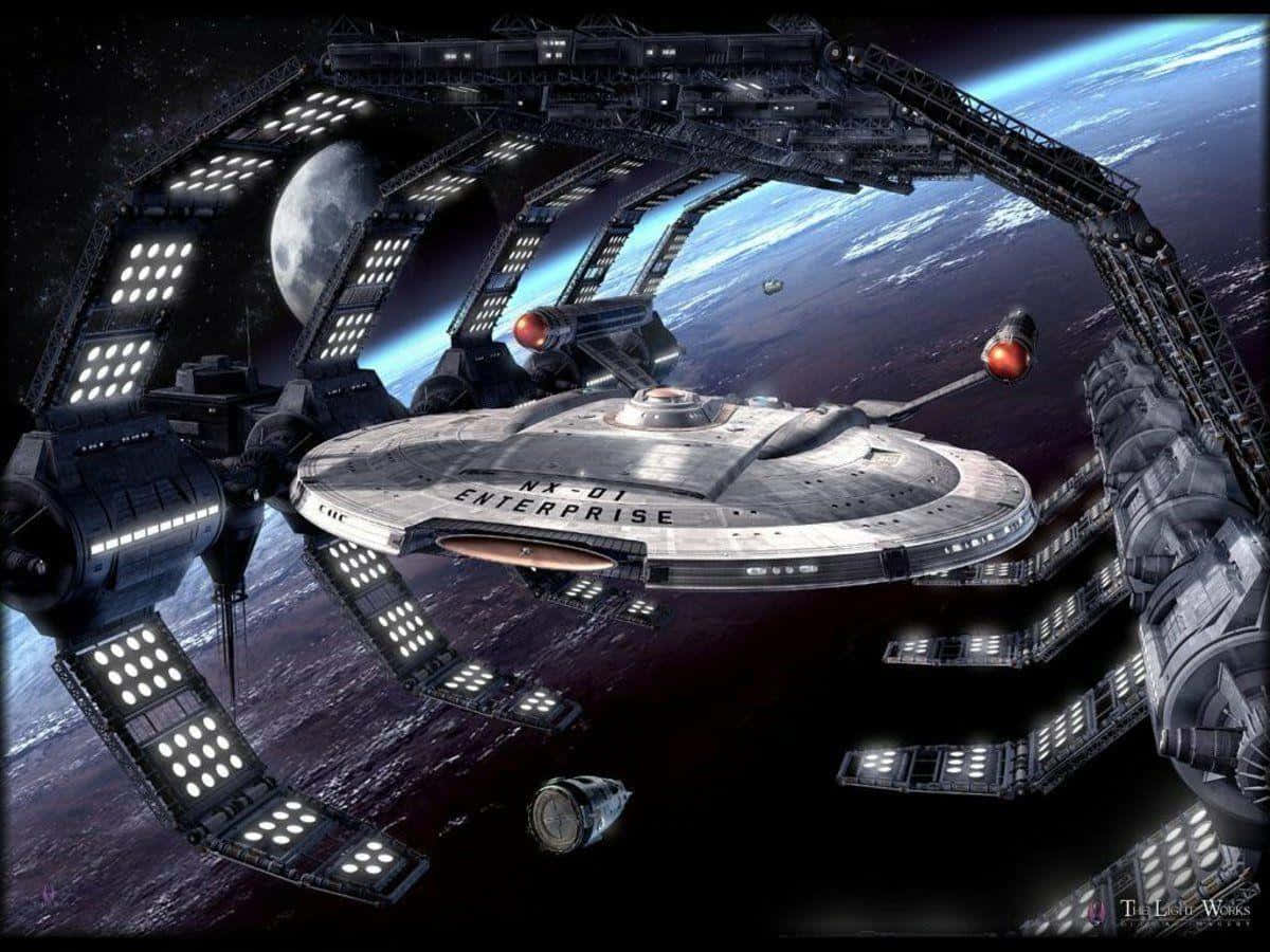 星艦企業號在藍色行星和月亮附近與太空站對接。