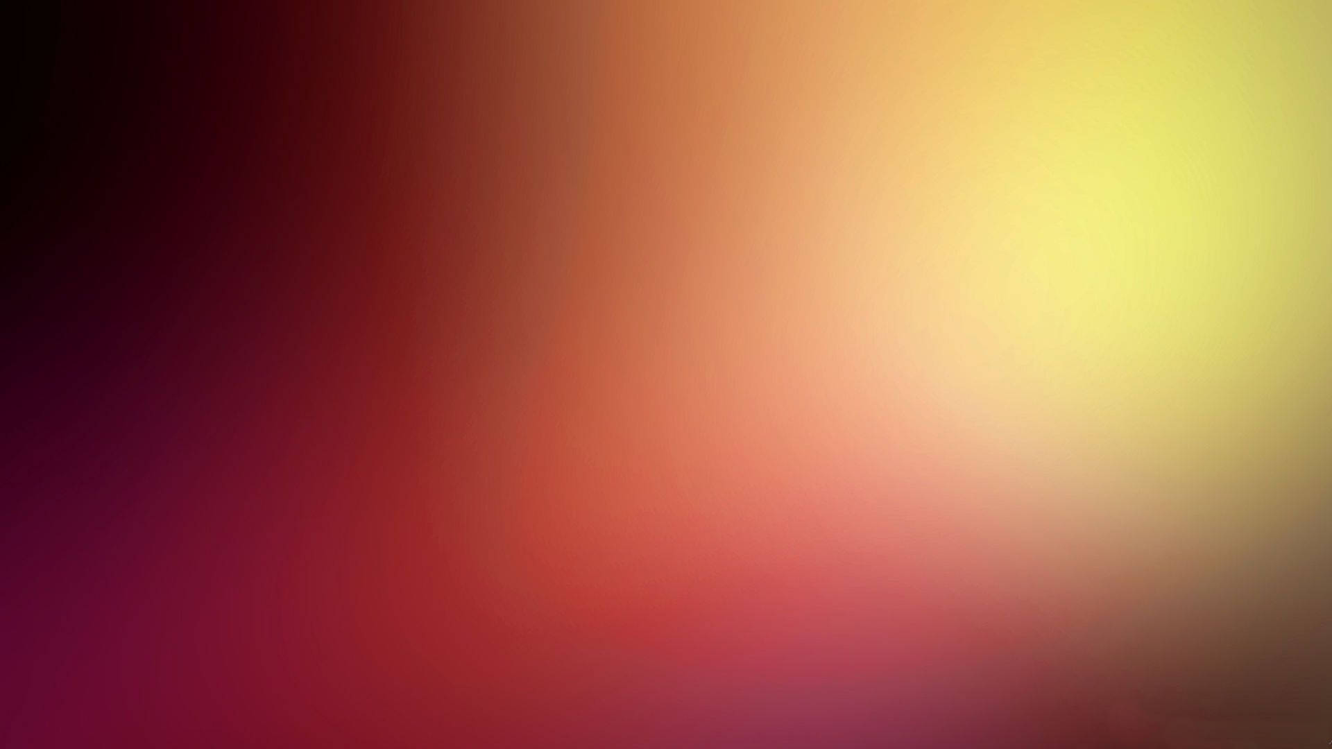 融合洋紅色和黃色色調的抽象漸變背景。