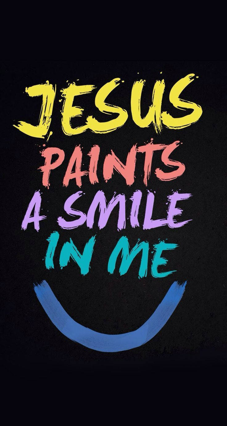 色彩繽紛的筆觸文字，寫著 Jesus paints a smile in me，並帶有藍色笑臉弧線。