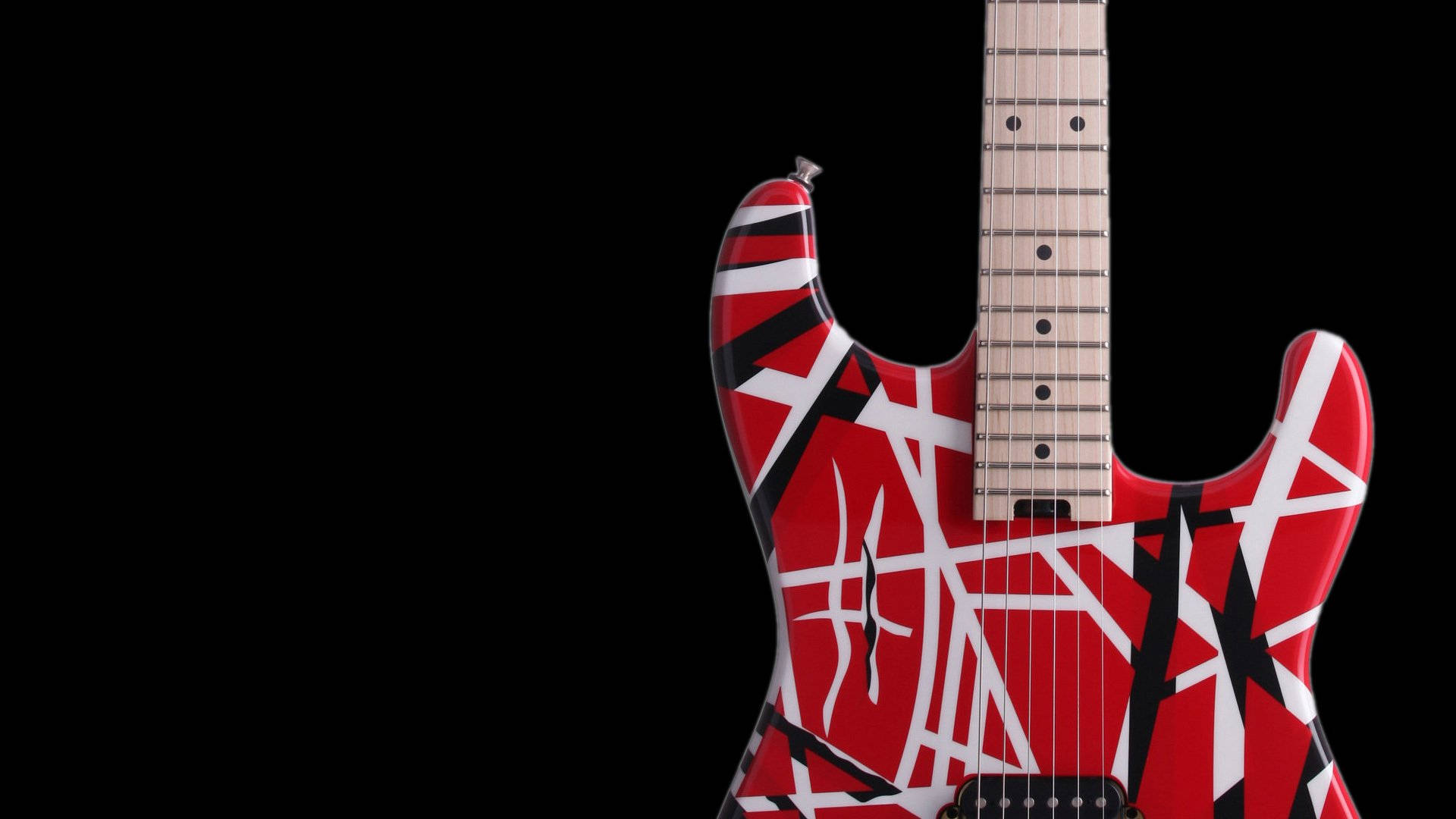 艾迪·范·海倫的 Frankenstrat 吉他 壁紙 — 一把紅、白、黑的電結他，帶有鮮明的棱角圖案，在純黑色背景上格外突出。