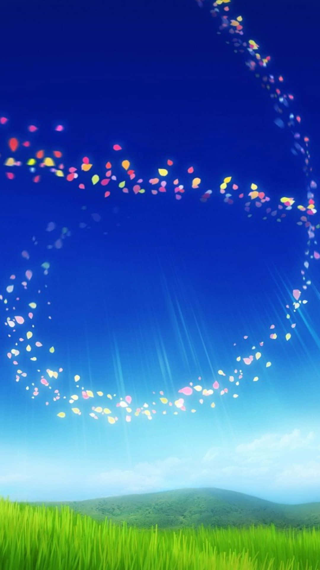 色彩繽紛的花瓣在藍天上形成發光的螺旋，下方是綠色田野。