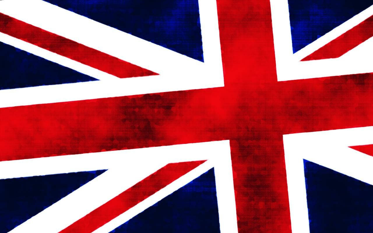 英國國旗放大影像 壁紙 — 英國國旗的紋理特寫，帶有鮮明的紅、白和海軍藍色。