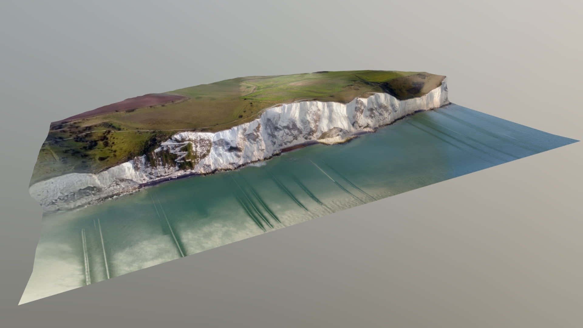 英國多佛白崖 3D 藝術 壁紙 — 3D 渲染的海岸懸崖，白色白堊面，綠色草頂，下方是碧綠色的水。