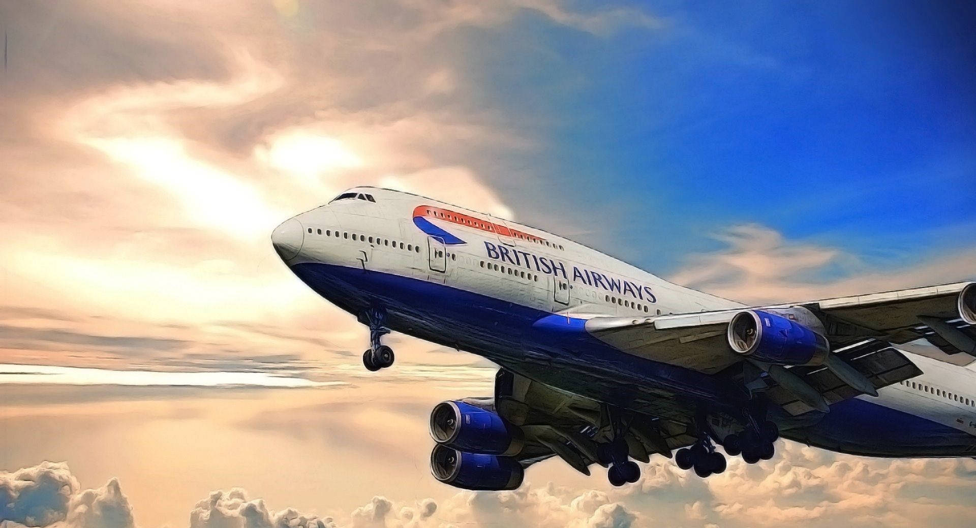 英國航空珍寶客機飛過色彩繽紛的日落雲層。