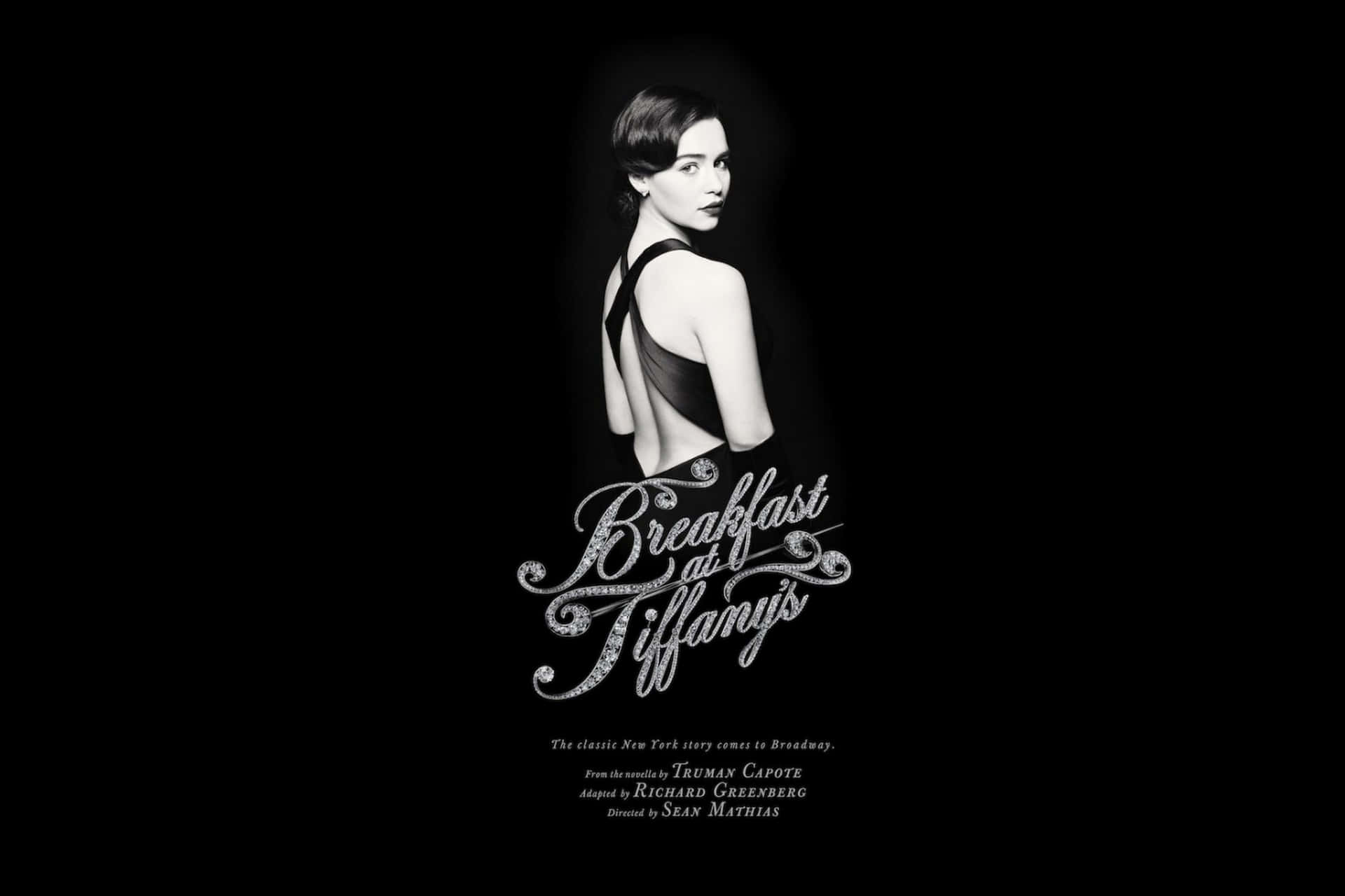 身穿黑色裙的女性轉頭回眸，帶有「Breakfast at Tiffany's」文字。