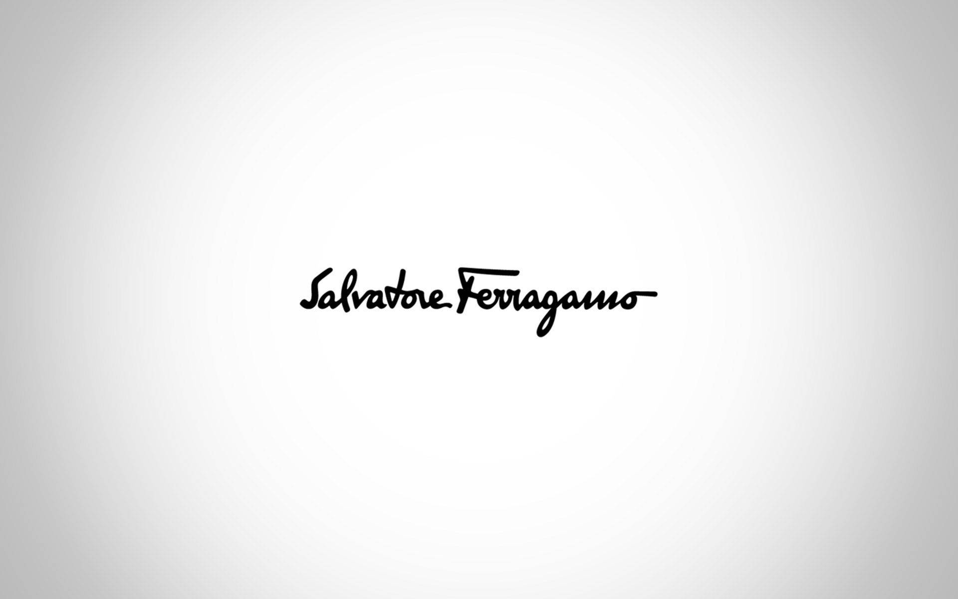 Salvatore Ferragamo標誌以黑色草書顯示在白色漸變背景上