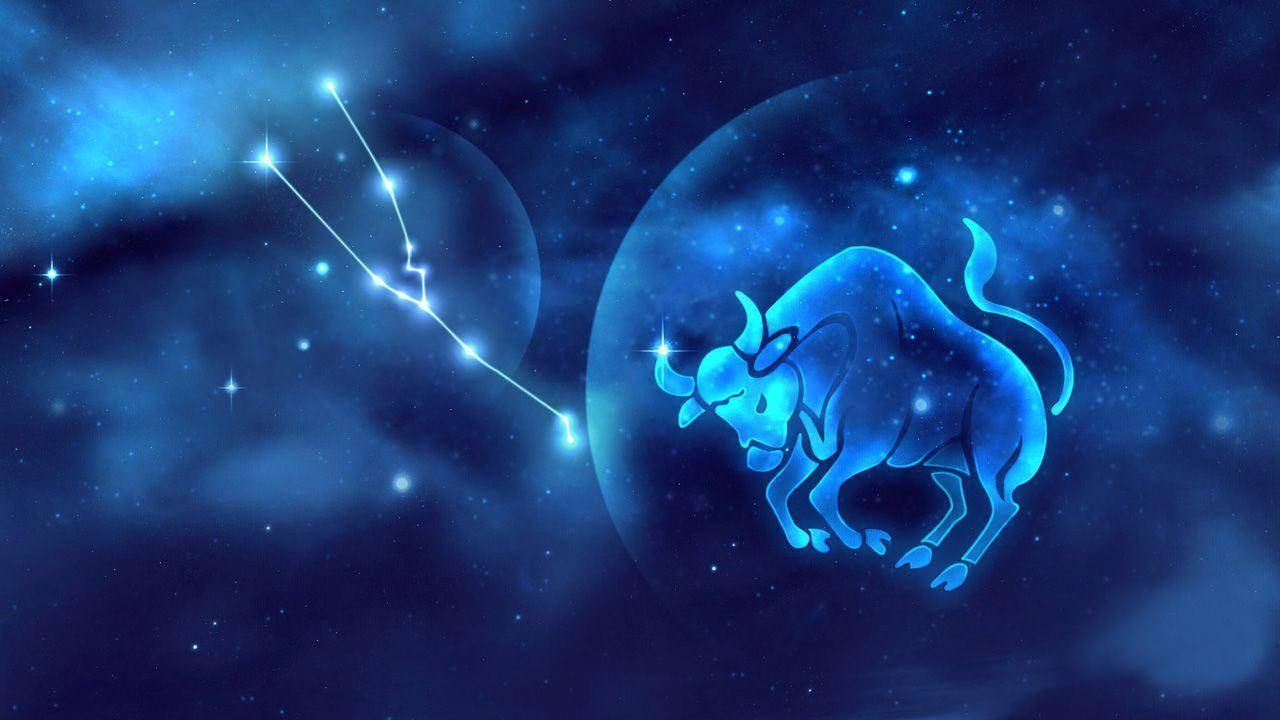 藍天金牛座 壁紙 — 一個發光的藍色金牛座星座在星雲中閃耀，背景是繁星點點的宇宙。