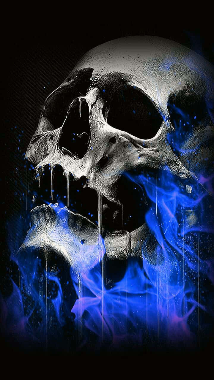 一個骷髏，口中噴出藍色火焰，背景為深色。 — 骷髏 壁紙