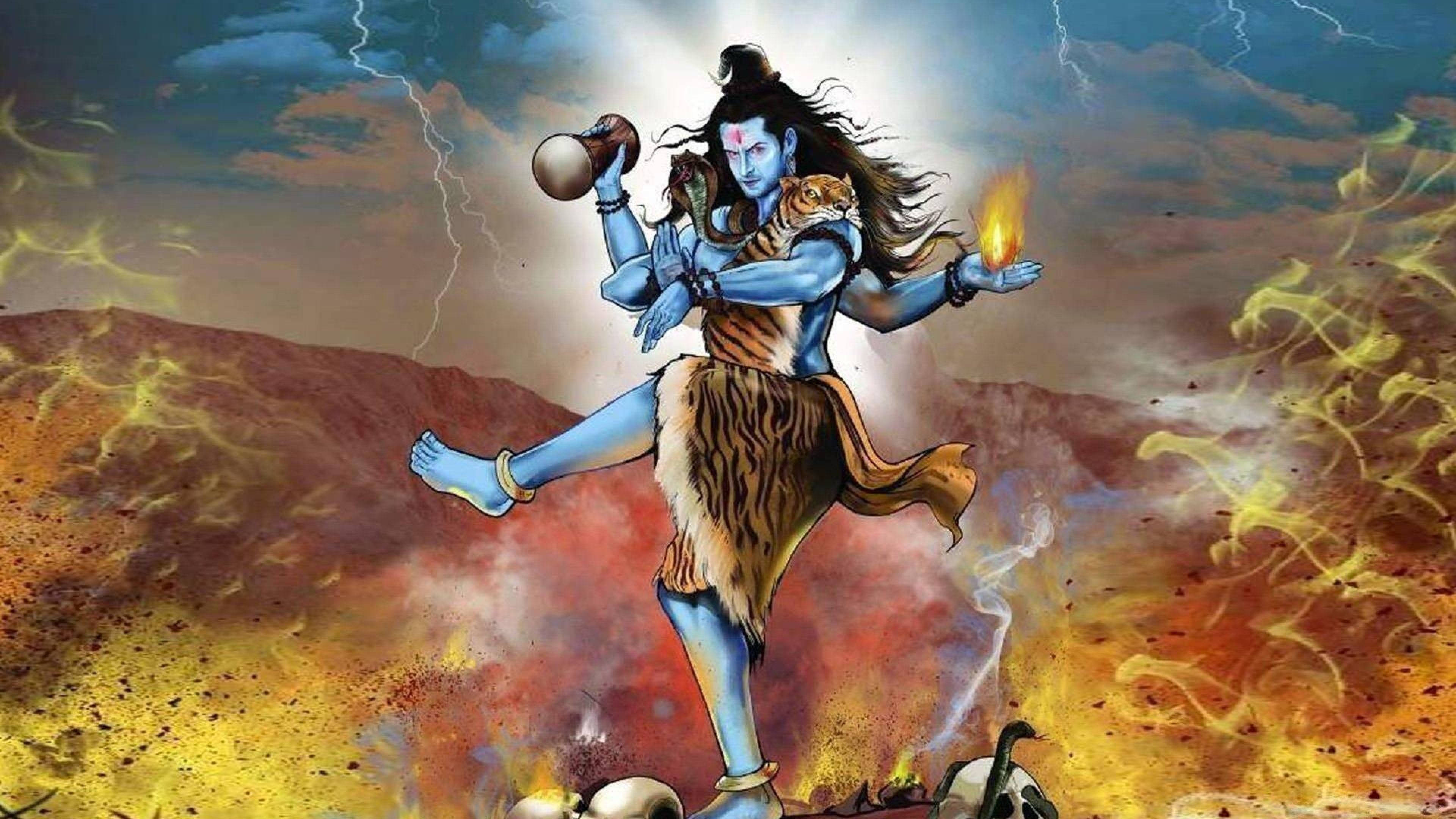 Lord Shiva 桌布 壁紙 — 藍皮膚印度教神祇濕婆在山頂上跳舞，周圍有火焰、閃電和頭骨，腰間圍著虎皮，手持三叉戟。