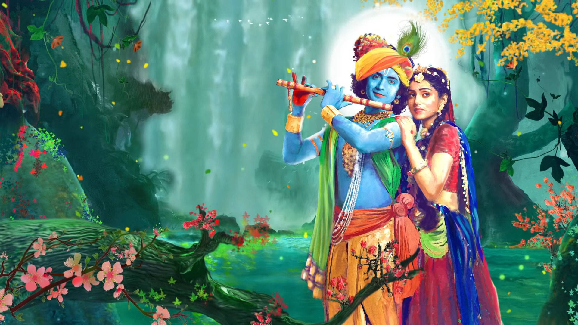 Mahabharat Krishna 桌布 壁紙 — 藍皮膚的克里希納在閃爍的月亮下，在鬱鬱蔥蔥的綠色森林中，伴隨著瀑布和盛開的花朵，在拉達旁邊吹奏長笛。