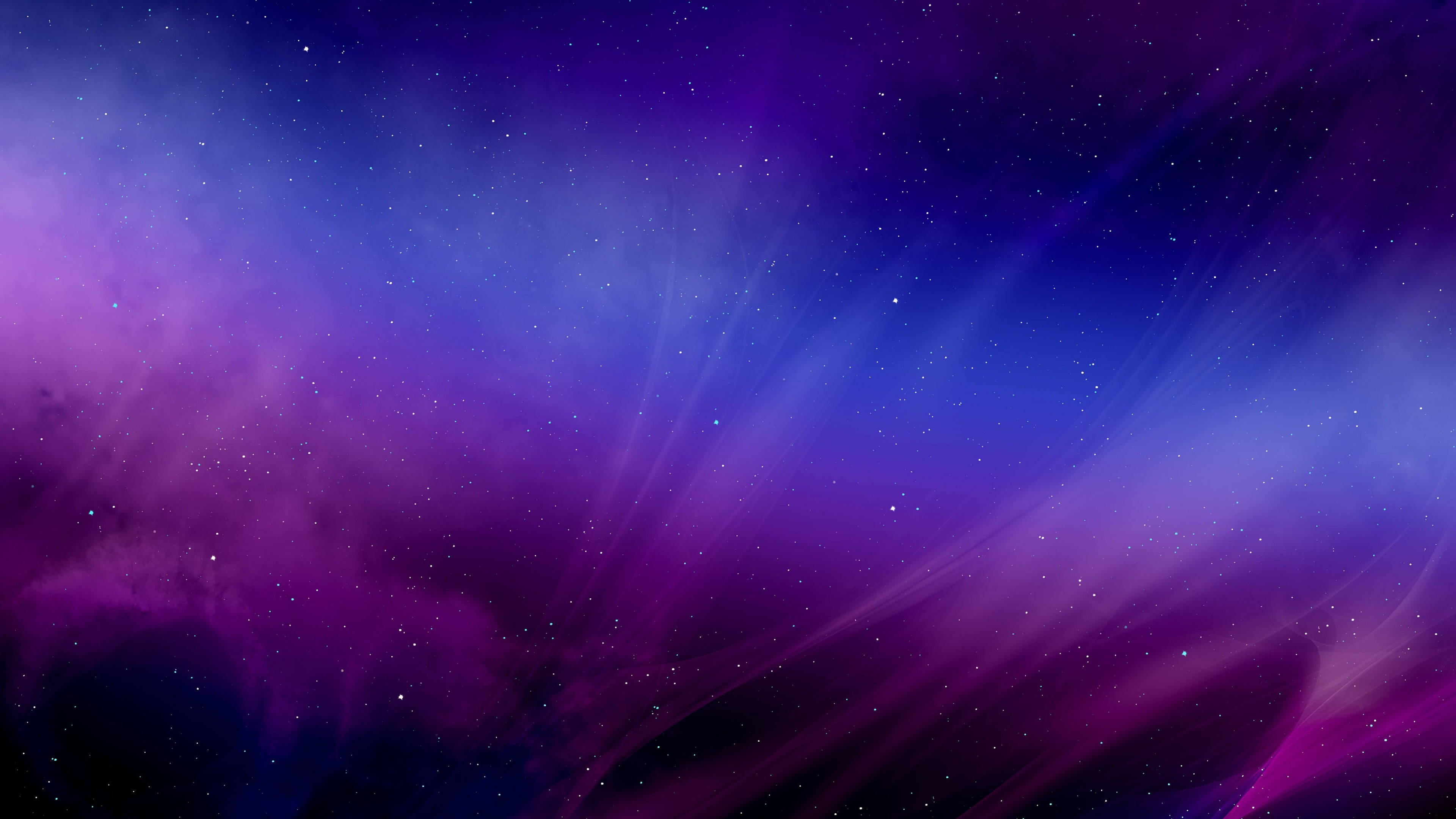 藍紫星系夜空色彩 壁紙 — 充滿活力的宇宙星雲在深紫色和藍色中旋轉，散落的星星在虛空中柔和地發光。