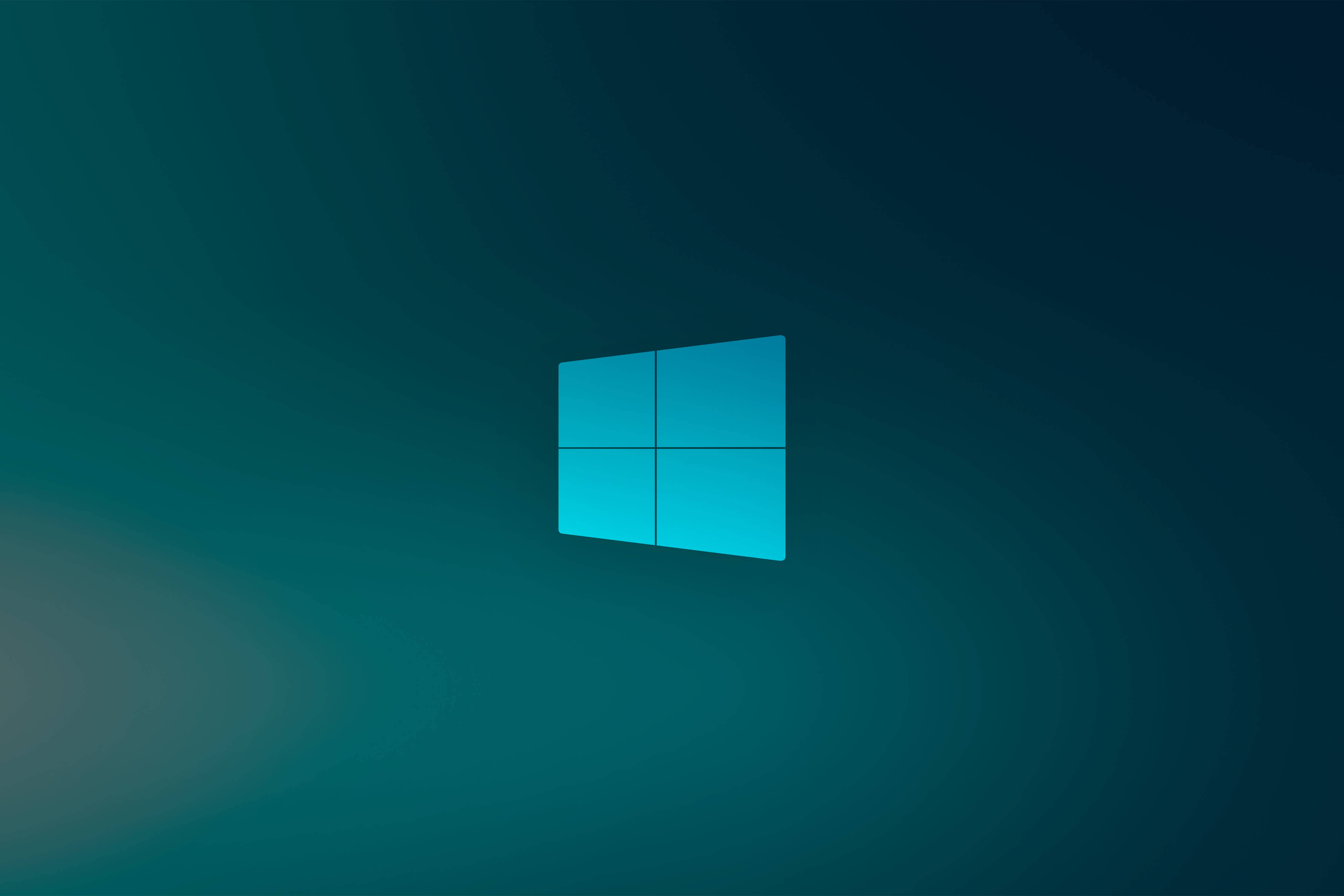 藍綠 Windows 10 高清 壁紙 — 發光的藍色Windows標誌居中於青綠色和深藍色漸變背景上，帶有柔和的放射光效果。