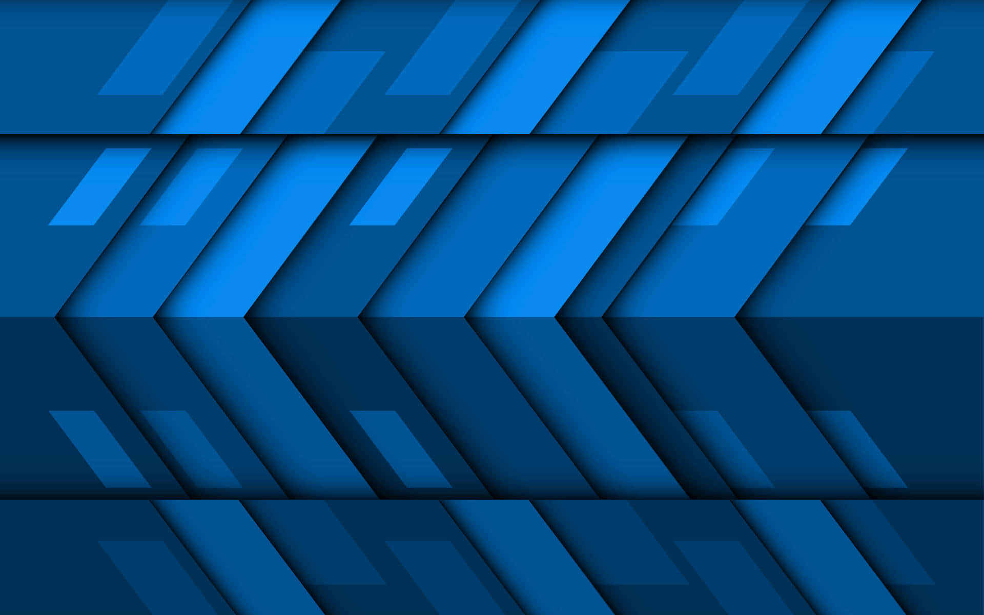 Material Design 桌布 壁紙 — 藍色人字形疊加而成的抽象幾何圖案，營造出具有深度和陰影的現代3D效果。