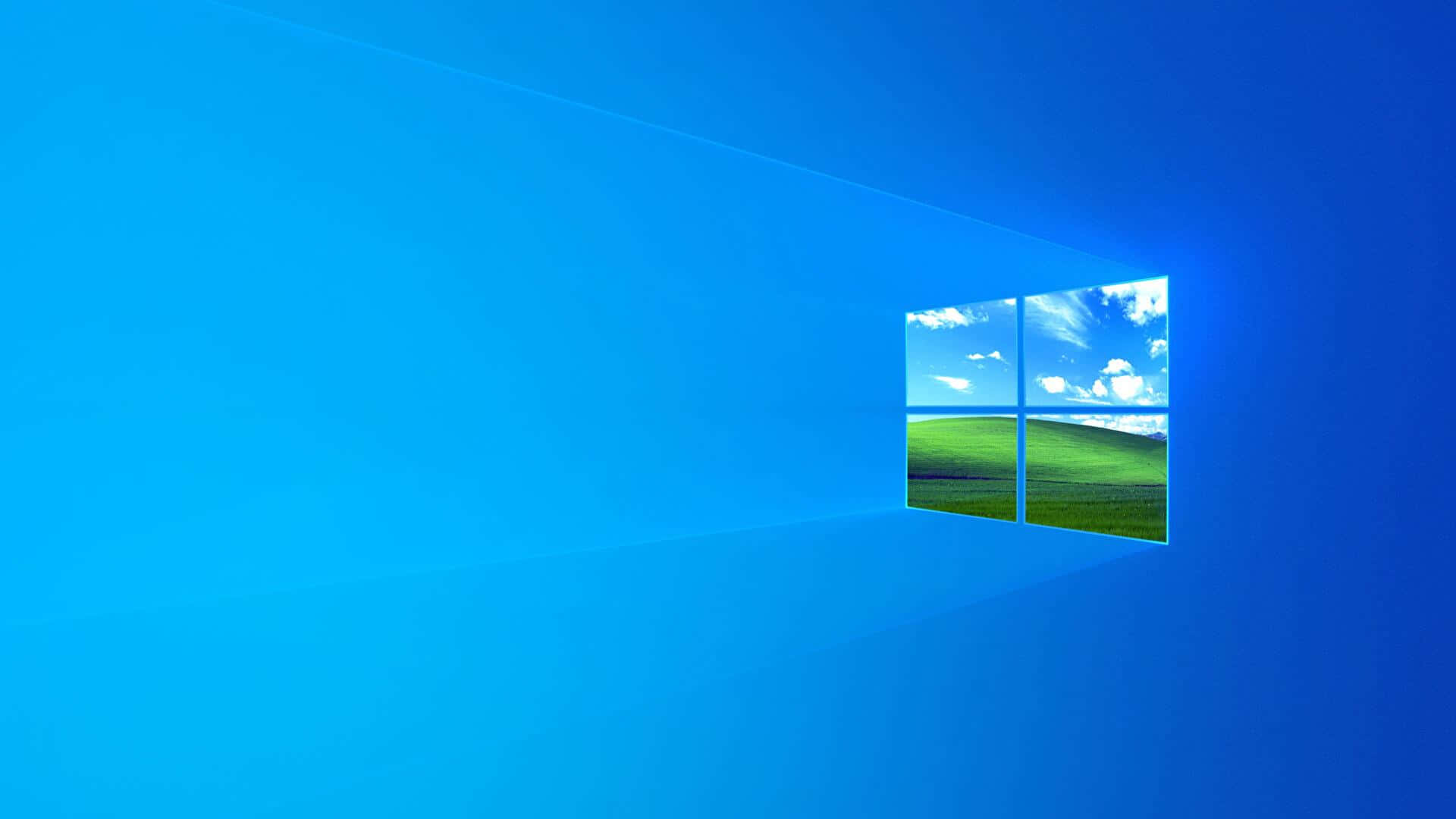 藍色地平線配 Windows 標誌 壁紙 — 一個發光的藍色窗框展現出在明亮藍天和蓬鬆白雲下的一片生機勃勃的綠色起伏山丘。
