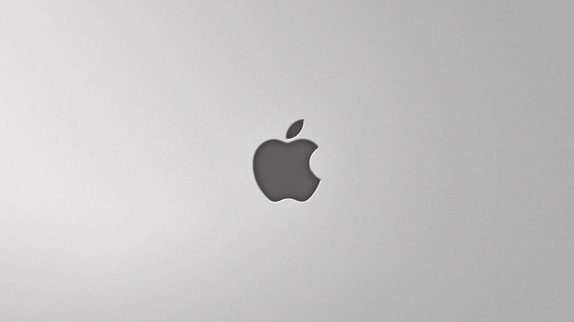 銀色筆記型電腦蓋上的Apple標誌