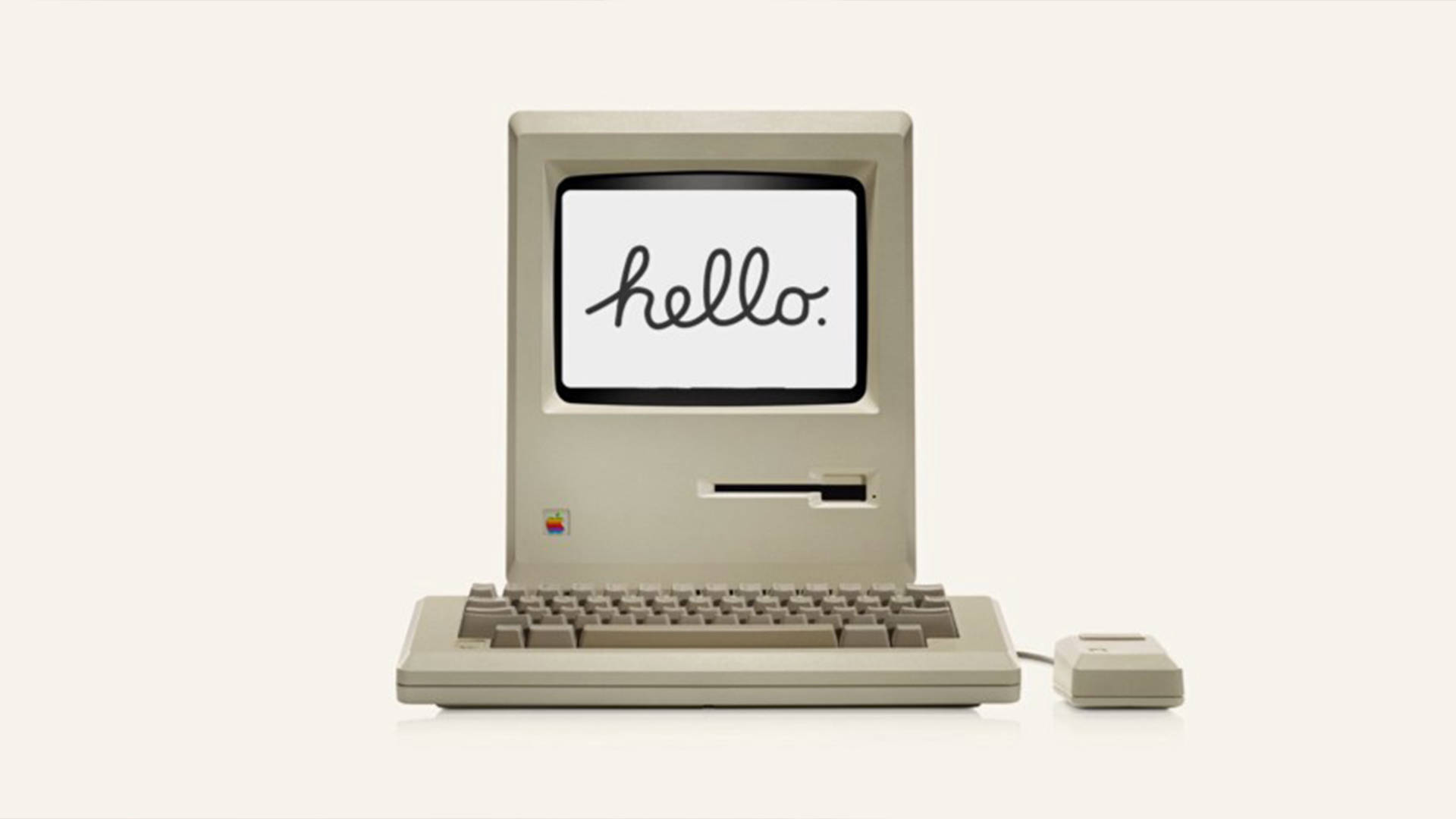 蘋果 Macintosh 電腦與「Hello」問候 壁紙 — 復古米色 Macintosh 電腦，屏幕上顯示 'hello.'，背景簡潔。