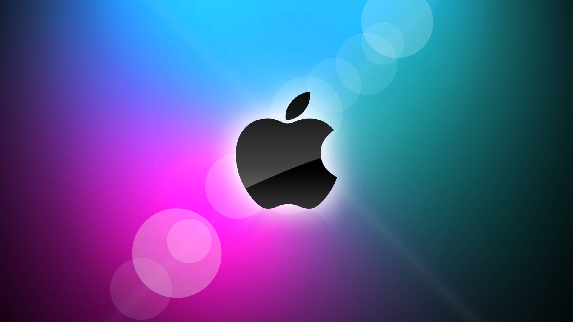 黑色Apple標誌置於彩色漸變背景中央，帶有發光的散景圓圈。