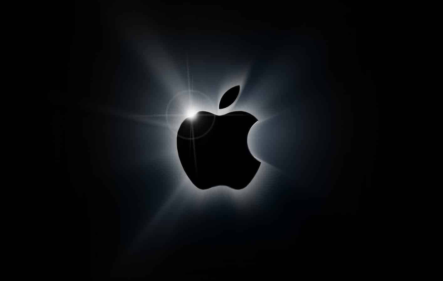 Apple標誌在黑暗背景上發光並帶有光線