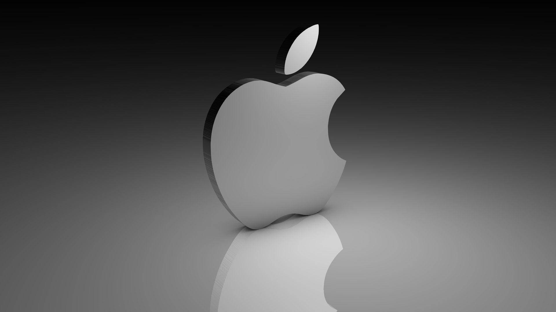 時尚銀色Apple標誌，帶有咬痕，位於反射表面上。