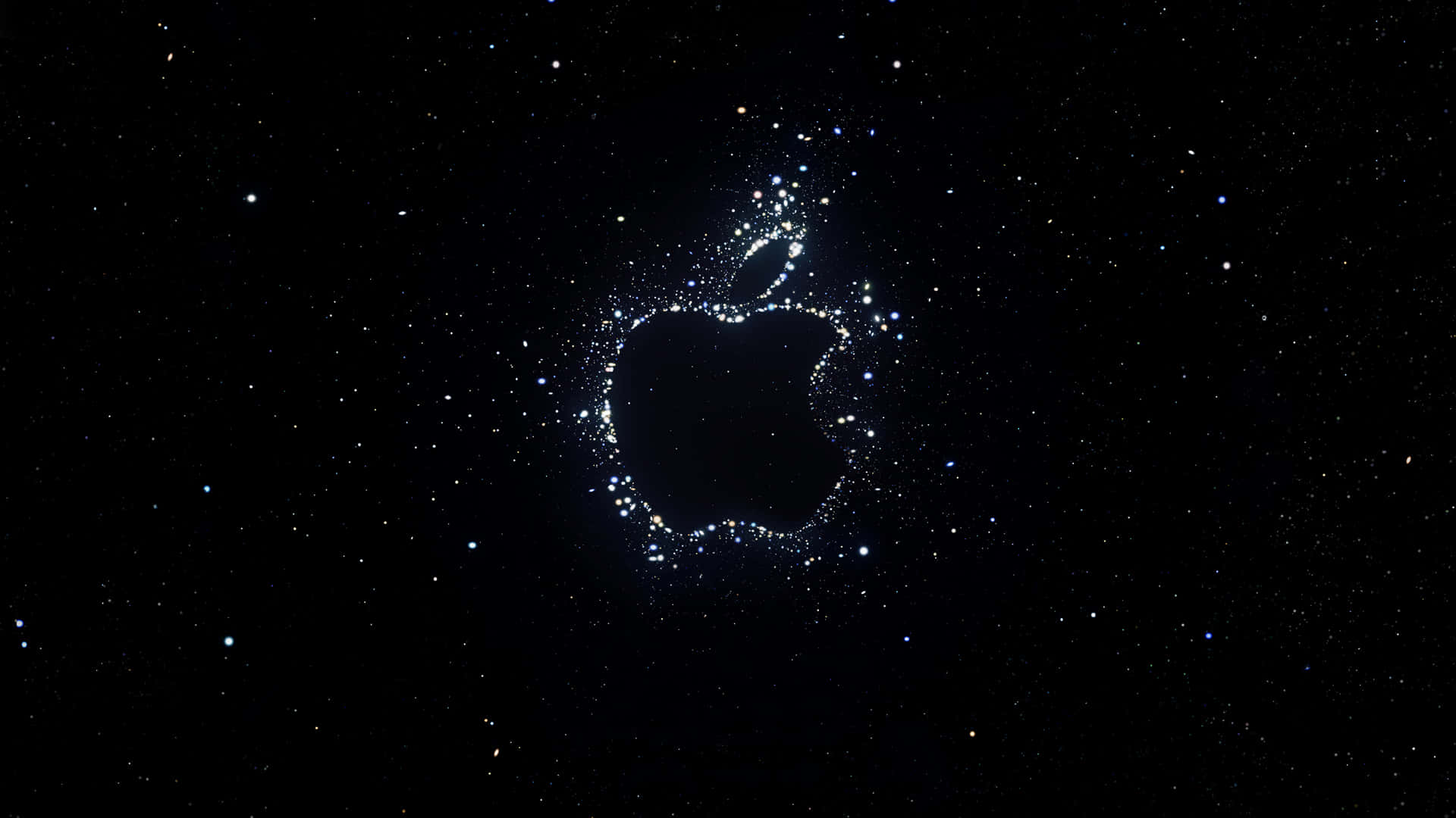 蘋果標誌星空背景 壁紙 — 一個由閃爍粒子組成的發光Apple標誌，漂浮在星空的宇宙黑色背景上。
