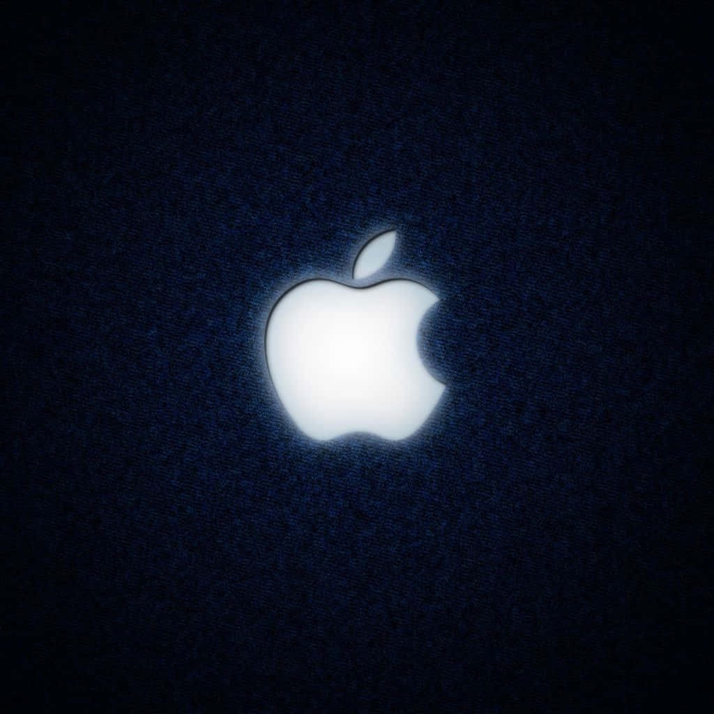 發光Apple標誌在深藍色紋理背景上