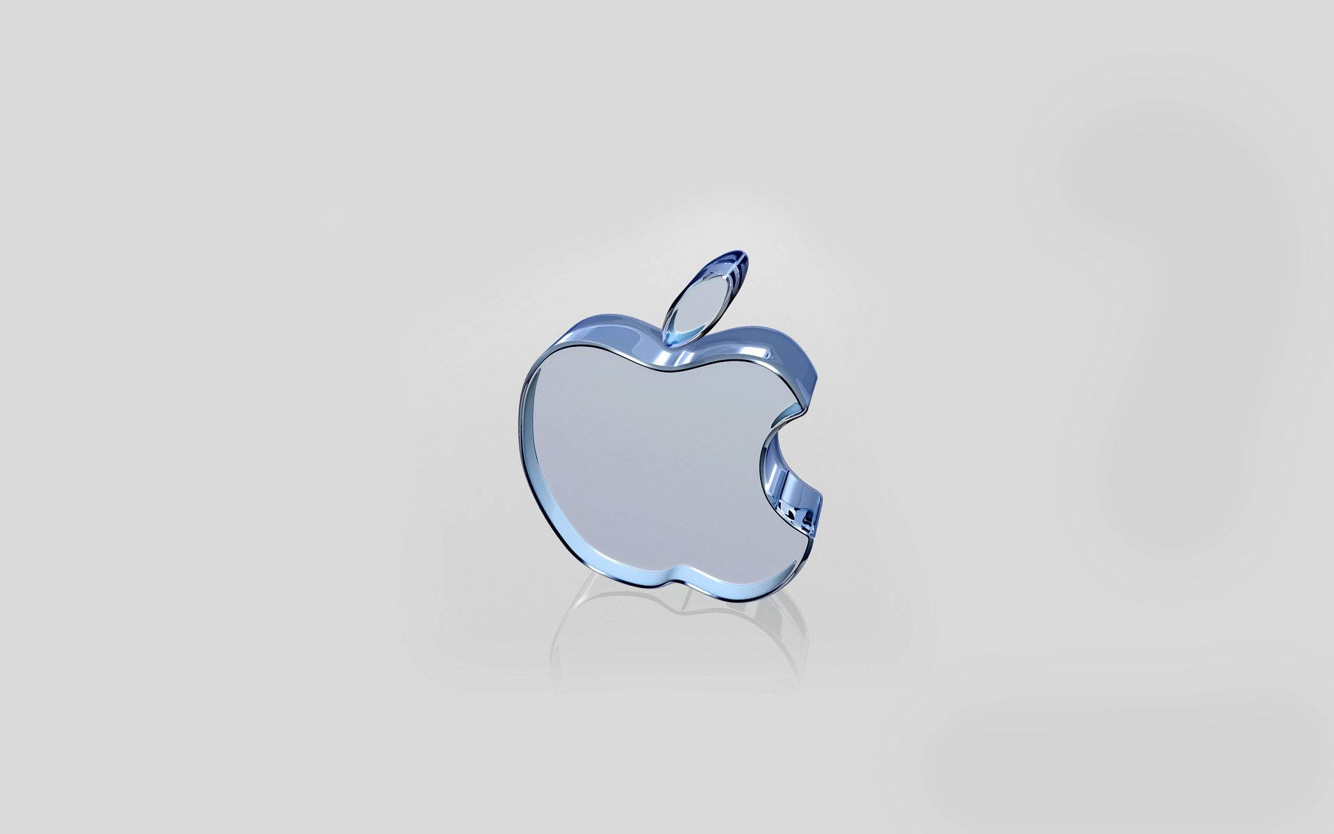 一個藍色玻璃Apple標誌，帶有咬痕和莖，在灰色背景上。