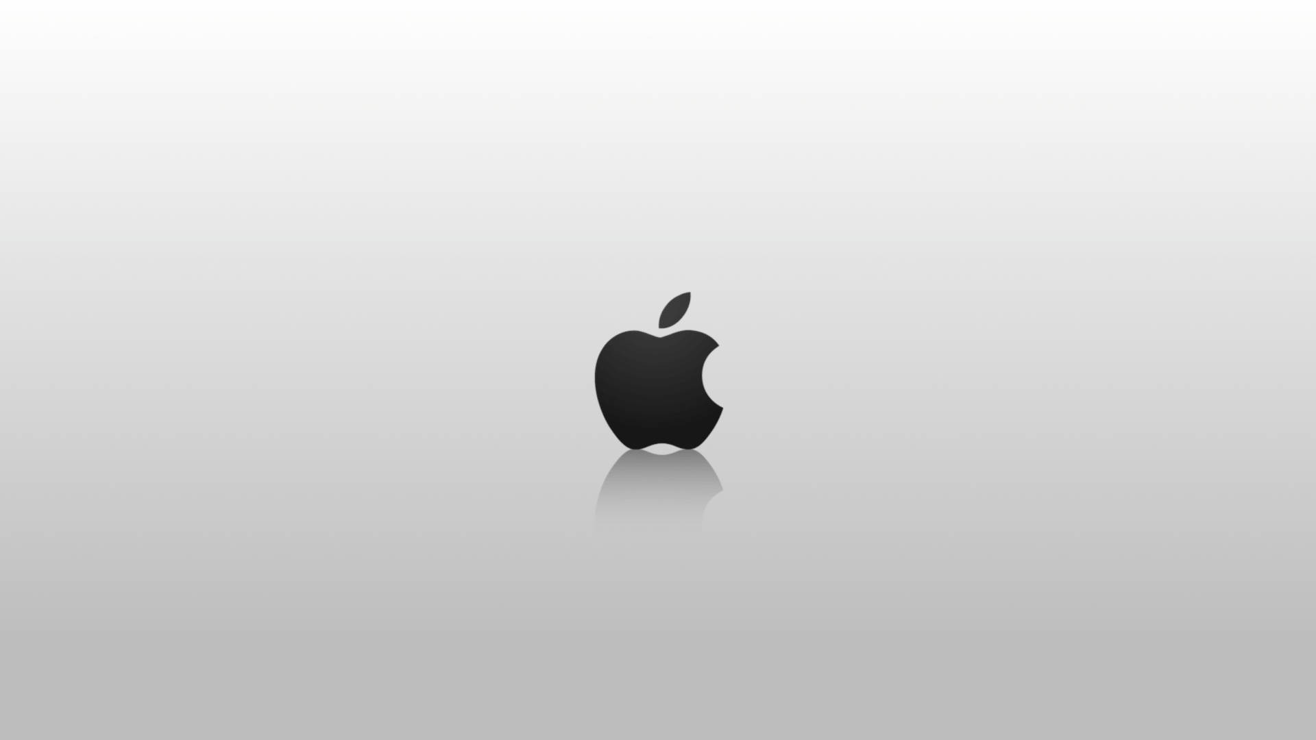 黑色Apple標誌在灰色漸變背景上反射