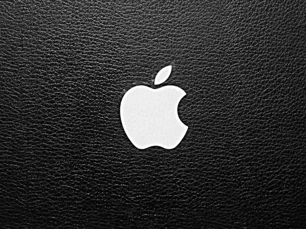 黑色皮革表面上的白色Apple標誌