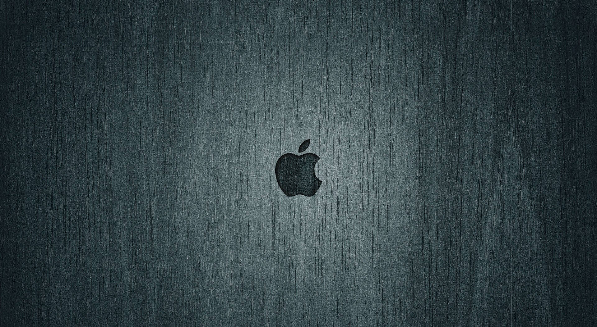 拉絲金屬背景上的Apple標誌