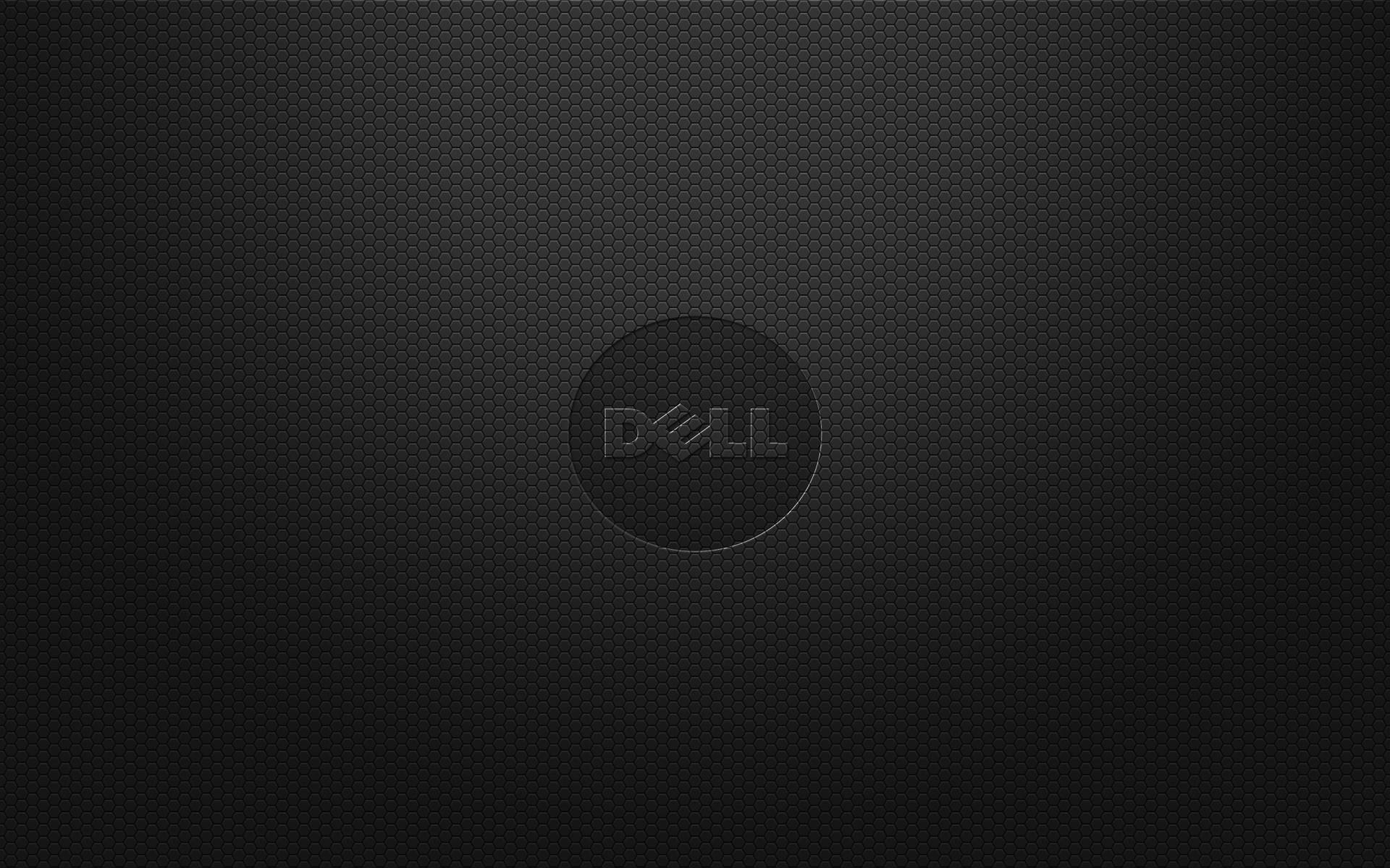 黑色紋理Dell筆記本電腦蓋，帶有中央標誌和漸變燈光。