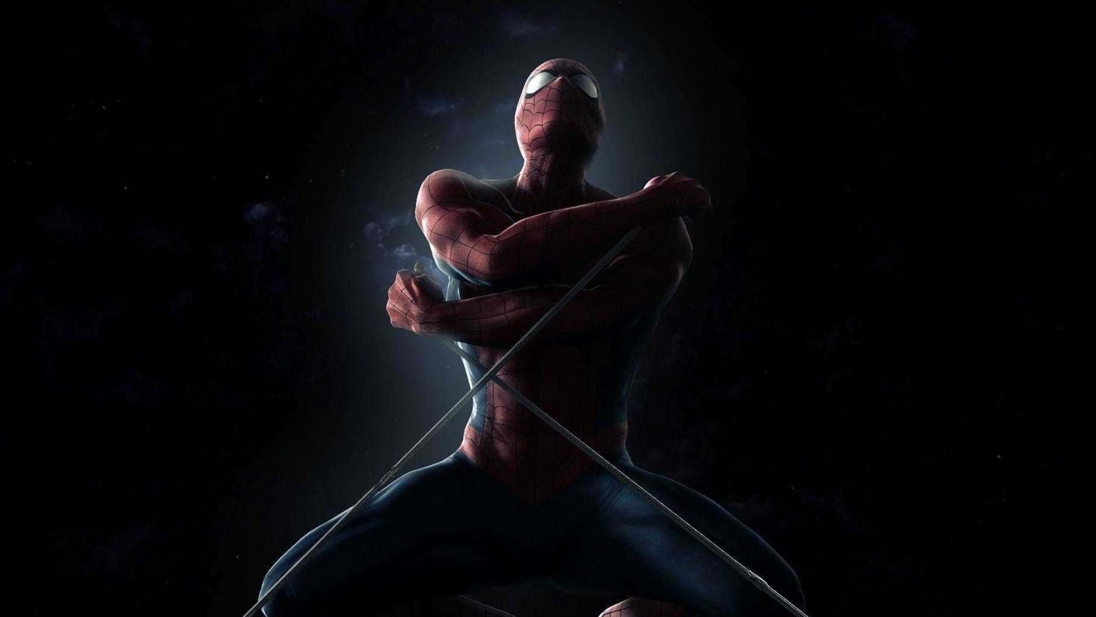4K Marvel 壁紙 桌布 壁紙 — 蜘蛛俠在黑暗的宇宙虛空中擺好姿勢，眼睛發光，蜘蛛網線條橫跨他的身體。