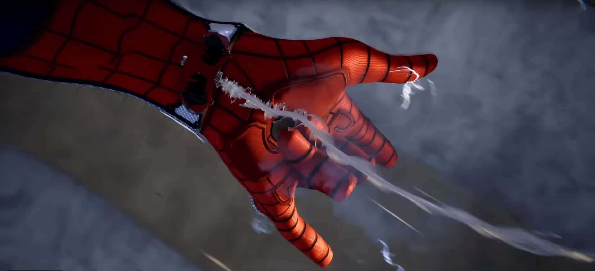 Spider-man Web Shooter 桌布 壁紙 — 蜘蛛俠紅藍手套的手部特寫，在煙霧灰色背景前發射蜘蛛絲。