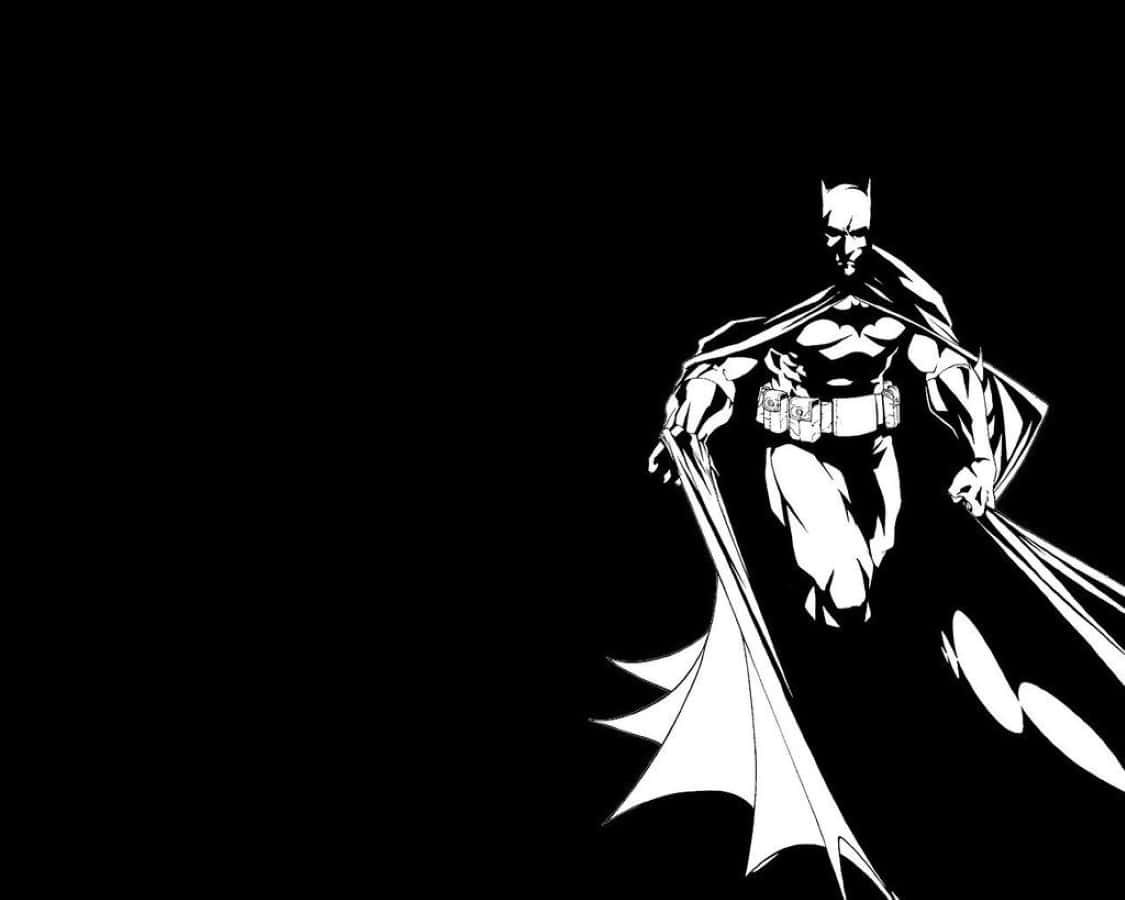 Black And White Comic 桌布 壁紙 — 蝙蝠俠以鮮明的黑白剪影站在黑暗虛空中，他的披風在他周圍動態飄動。