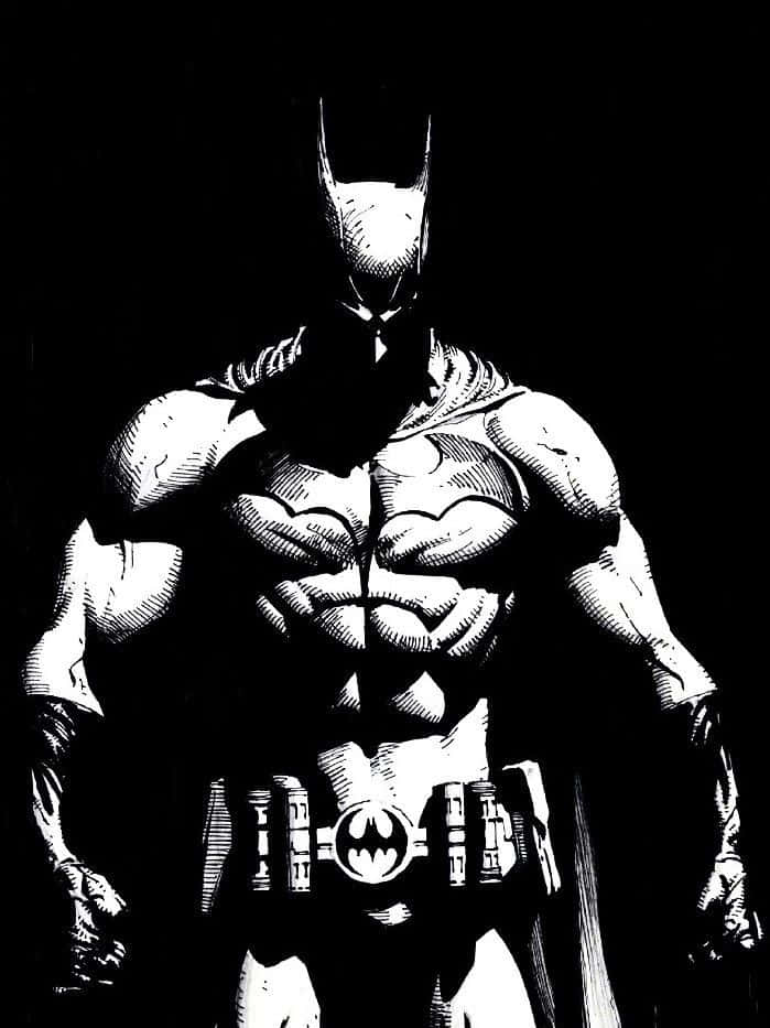 Batman Knightfall 桌布 壁紙 — 蝙蝠俠以鮮明的黑白對比站立，戲劇性的燈光突顯他肌肉發達的身材和標誌性的頭罩。