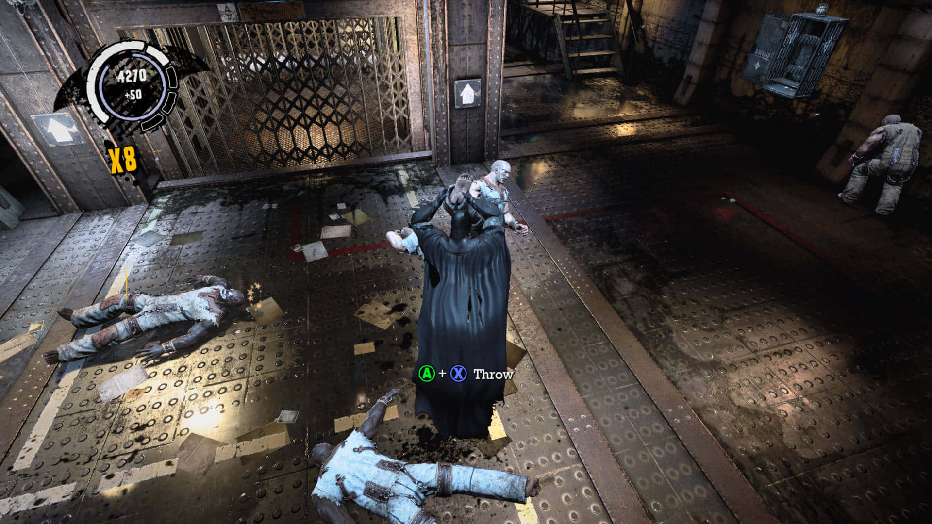 Arkham Asylum 桌布 壁紙 — 蝙蝠俠在一個骯髒的工業倉庫中，將一個類似殭屍的敵人扔出，地上有血跡和倒下的敵人。