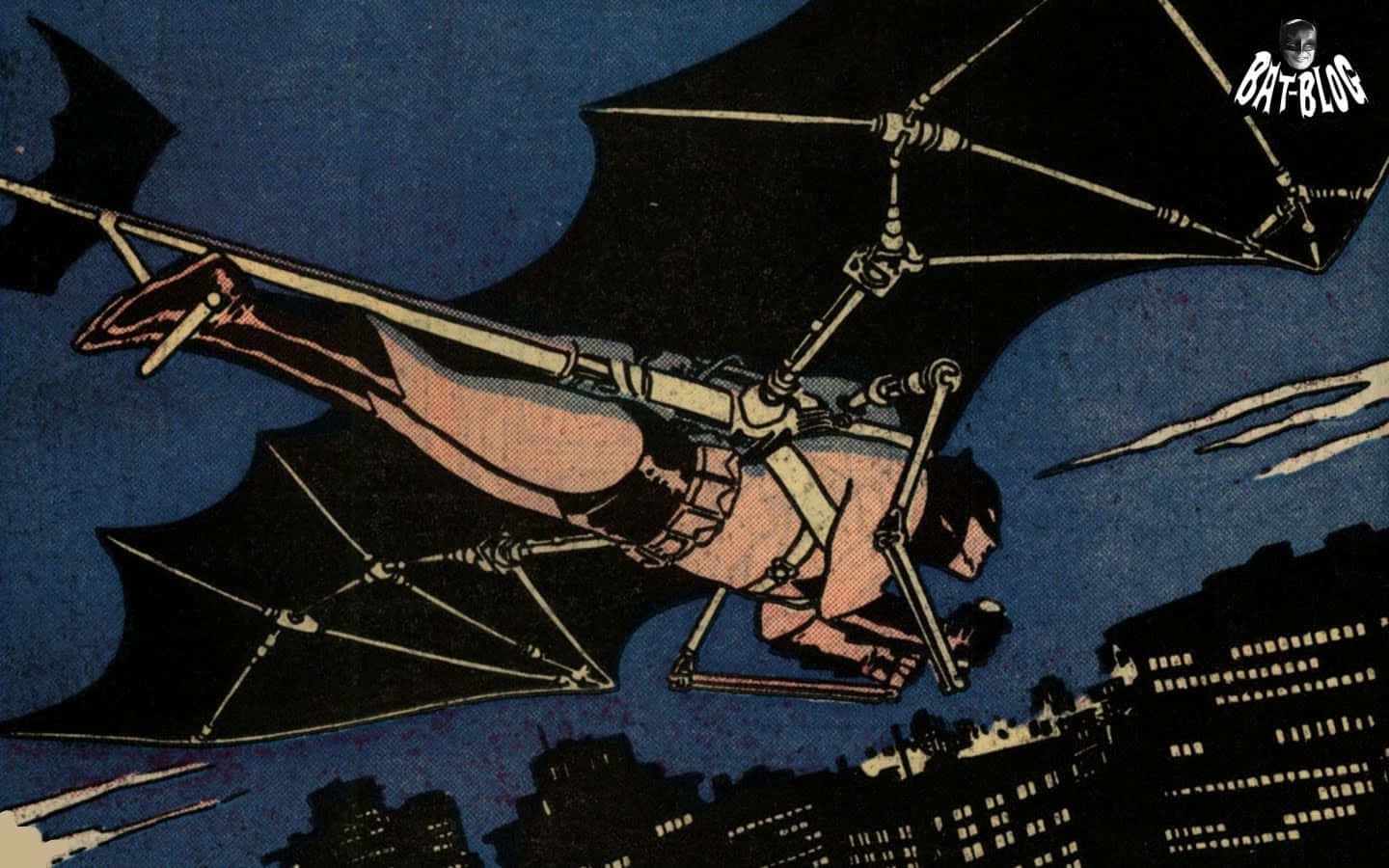 Batman Year One 桌布 壁紙 — 蝙蝠俠在機械蝙蝠翼滑翔機中，於黑暗的夜空中飛越城市天際線。